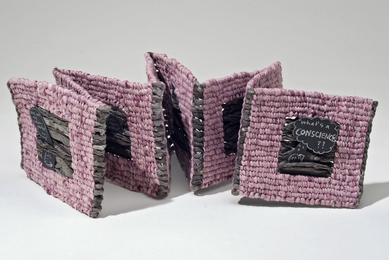 What's a conscience? (2012). Pen on paper, cochineal dye, ink, spun and woven hanji, 8 panels, 4 x 3.75 x 2" closed, 34" wide open. Indiana University Fine Arts Library collection.