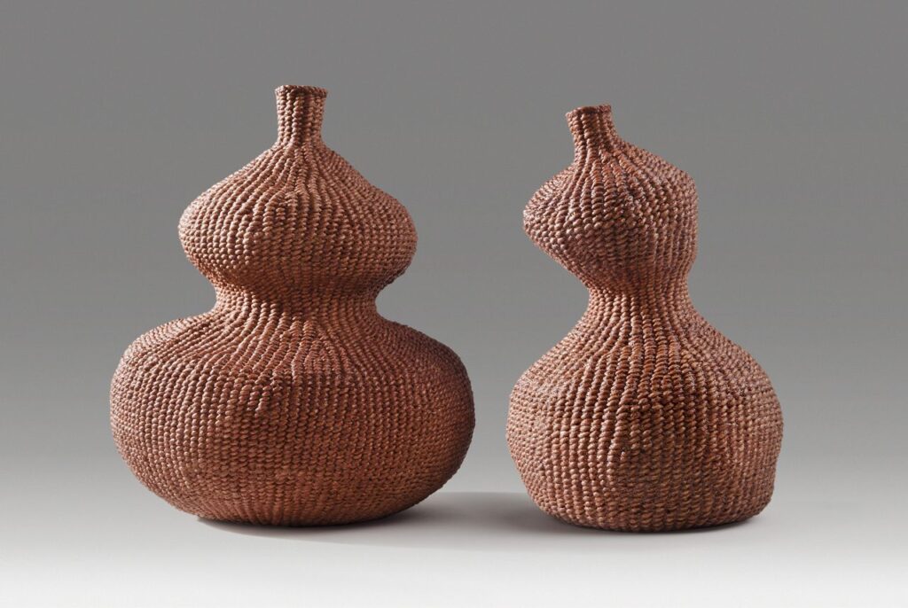 Paired gourds (2014). Persimmon dye on hanji. 7" high, 6" wide; 6.5" high, 3.5" base diameter. Private collection.