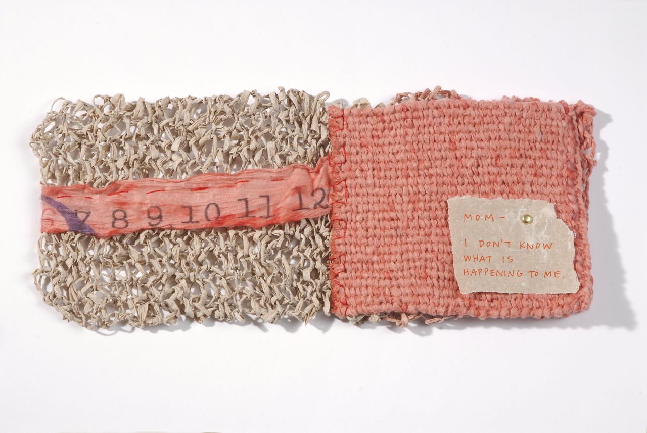 Chapter Fifteen (2009). Spun, knit, corded, and woven handmade paper (abaca, hemp, and dyed hanji), pen on hemp paper, thread. 4 x 5 x 0.75". U of Denver Penrose Library Collection.