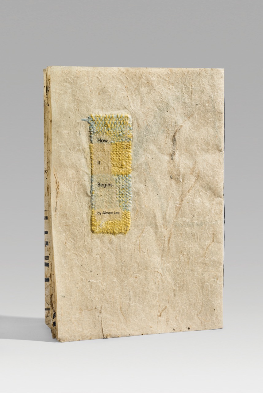 How It Begins (2018). Inkjet on handmade milkweed and mulberry paper embedded with paper threads and woven paper. 9.75 x 6.75 x 0.25" closed, 10 pages. Scripps College Denison Library collection.