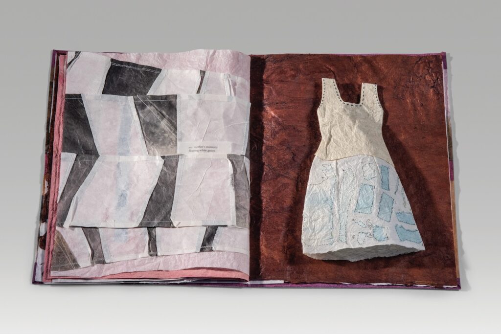 Pelagic inheritance (2022). Inkjet print and natural dyes on handmade papers, thread, paper thread, bark lace, woven paper, deconstructed paper dresses. 12.75 x 8 x 0.5” closed. One of a kind. Cynthia Sears collection, BIMA.
