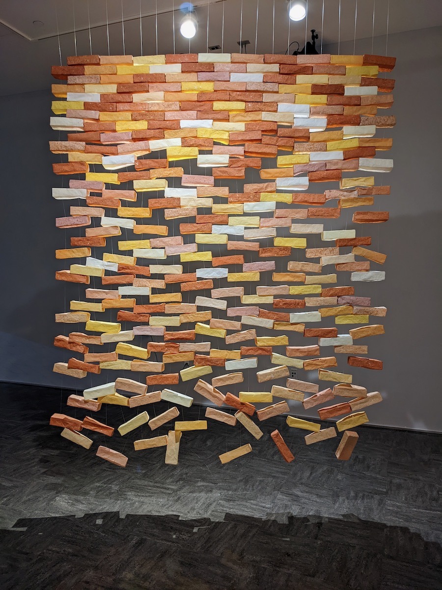 The walls are no defense (2022). Handmade abaca paper, monofilament, clips. 80 x 97 x 4”