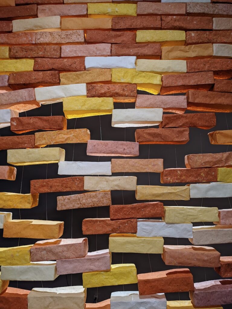 The walls are no defense (2022). Handmade abaca paper, monofilament, clips. 80 x 97 x 4”