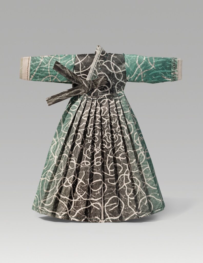 Pati (2025). Ink on newsprint, thread (prints by Pati Scobey). 7.6 x 7 x 1”.