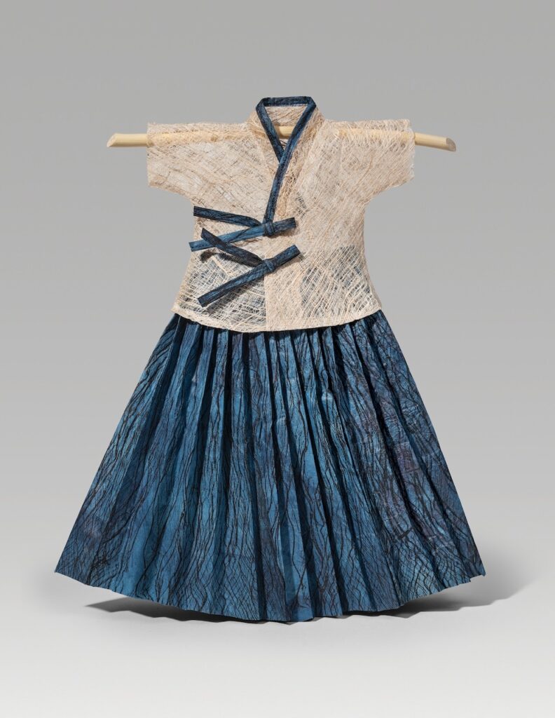 Return (2025). Mulberry bark lace, ink and indigo on hanji, thread. 13.75 x 12 x 2”.