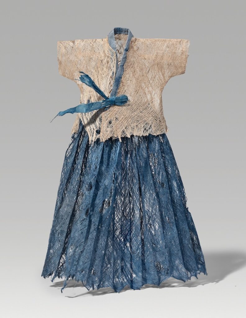 Wavy (2025). Mulberry bark lace, indigo on hanji, thread. 15.25 x 11 x 1.5”.